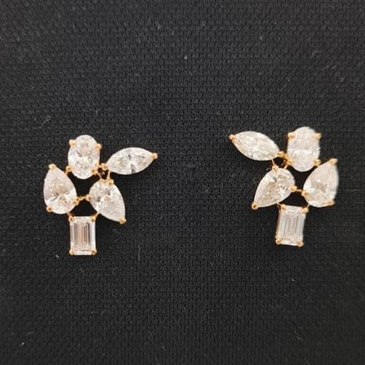 Pair of diamond earrings on a black background