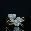 Gold ring with 1.9 carat diamond stone on reflective surface
