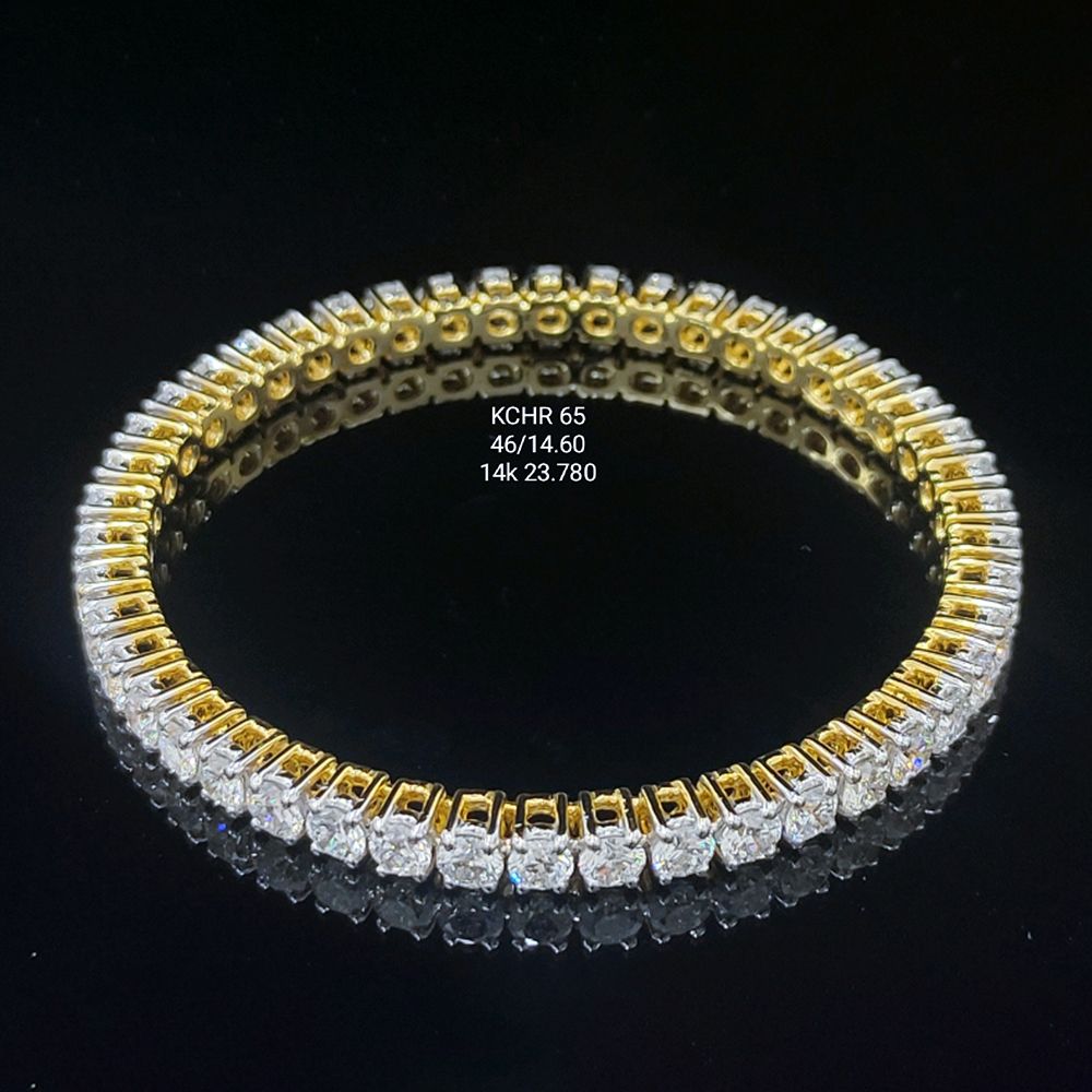 14.6 carat round shaped diamond bangle in 14K gold on black background
