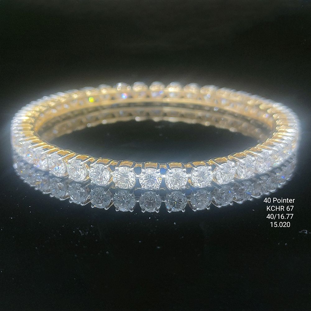 16.77 carat round shaped diamond bangle in 14K gold on black background
