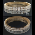 17.84 carat round shaped diamond bangle in 18K gold on black background
