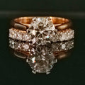 Gold ring with 2.16 carat diamond stone on reflective surface
