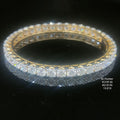 20.9 carat round shaped diamond bangle in 14K gold on black background
