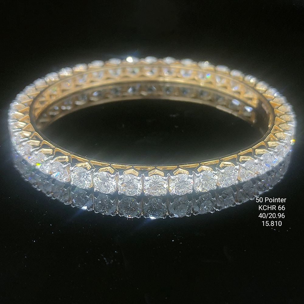 20.9 carat round shaped diamond bangle in 14K gold on black background
