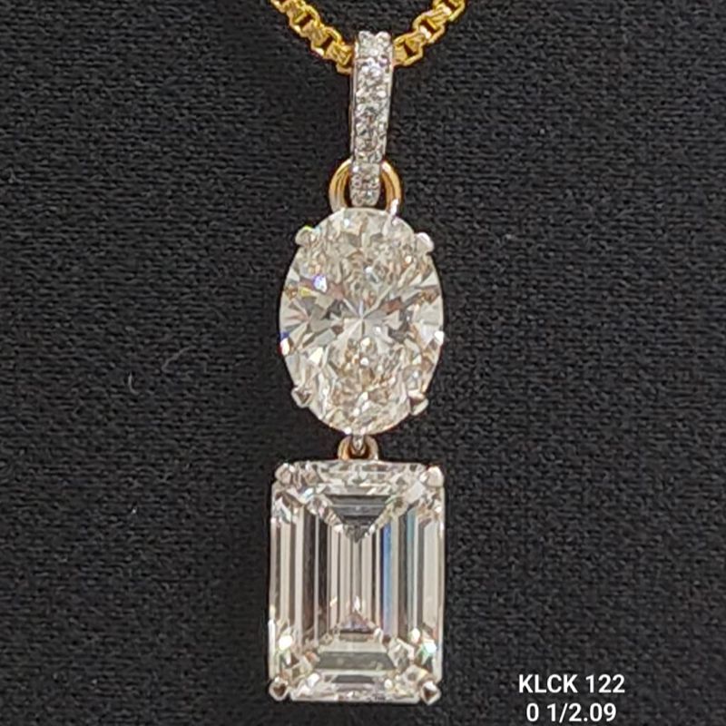 6.2 carat small round shaped diamond locket in 18K gold on black background
