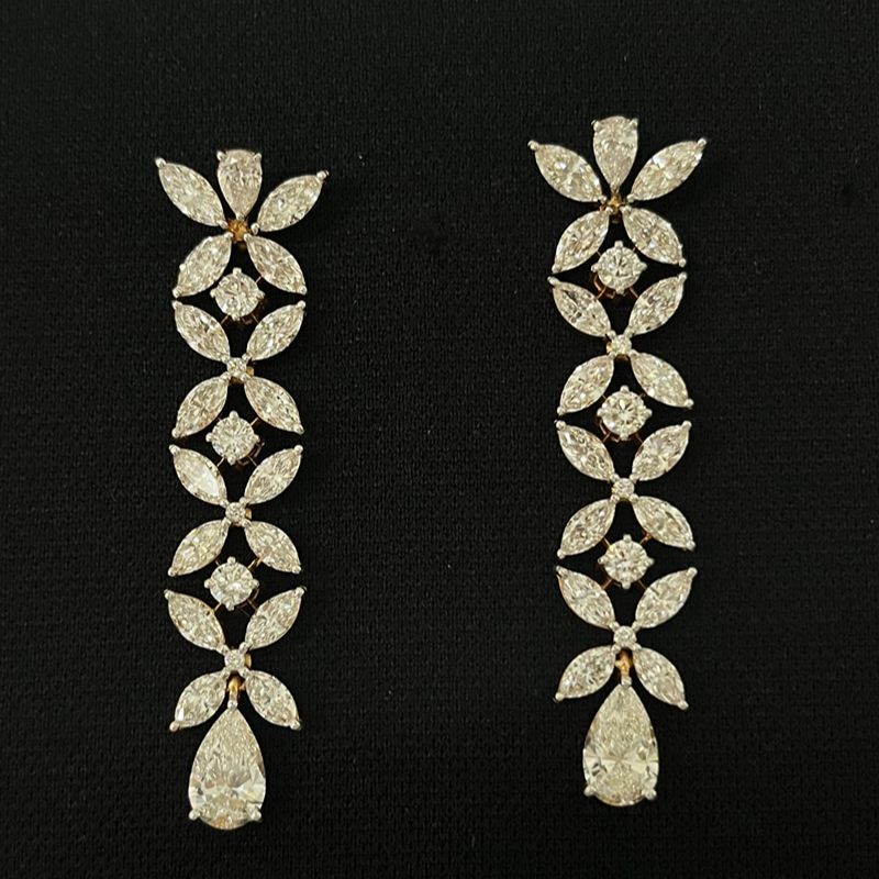 Gold necklace and earring set with large diamond stones 14K on black background
