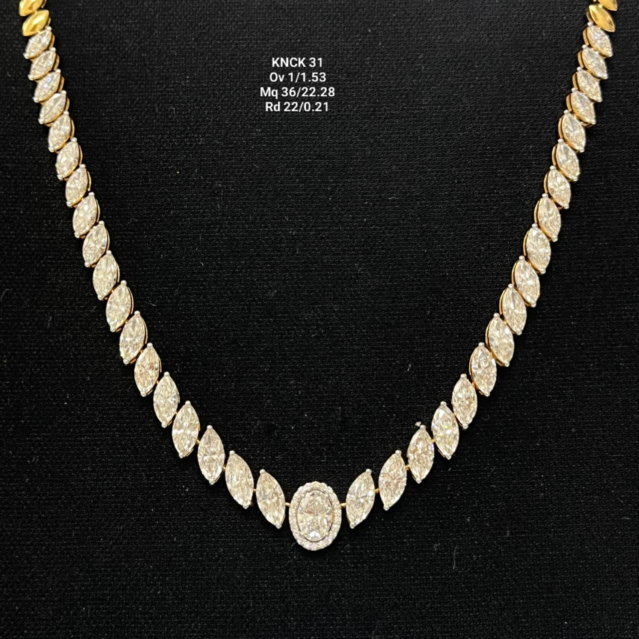 Diamond necklace on a black background with measurements displayed.