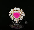 Jewelry item with a pink gemstone and diamond accents on a black background